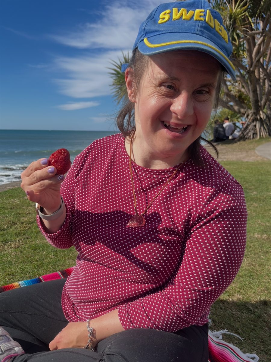 Jess out on a picnic rug by the beach