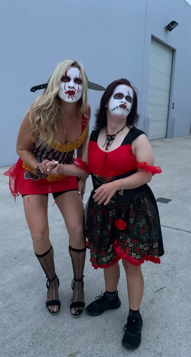 Two people dressed up in Halloween costumes