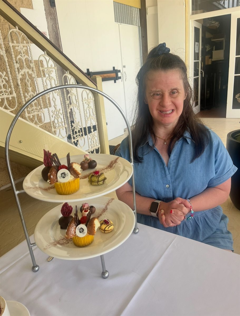 Sitting at a table with a tiered high tea stand
