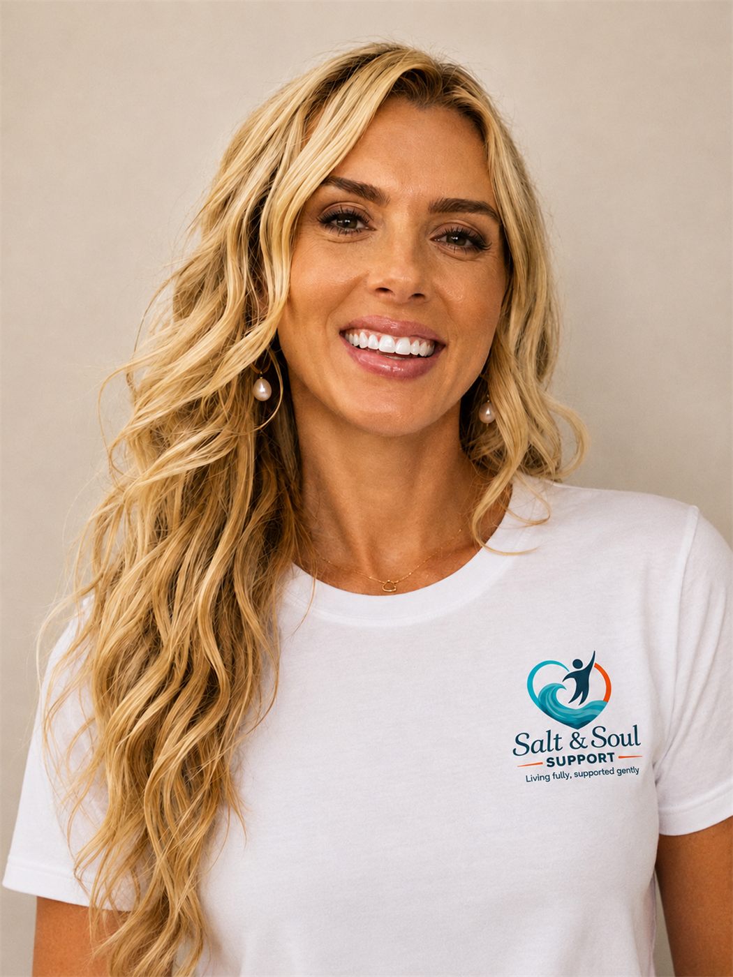 Renee, founder of Salt and Soul Support, smiling in a Salt and Soul shirt
